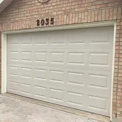 A garage door that is open and has numbers on it.